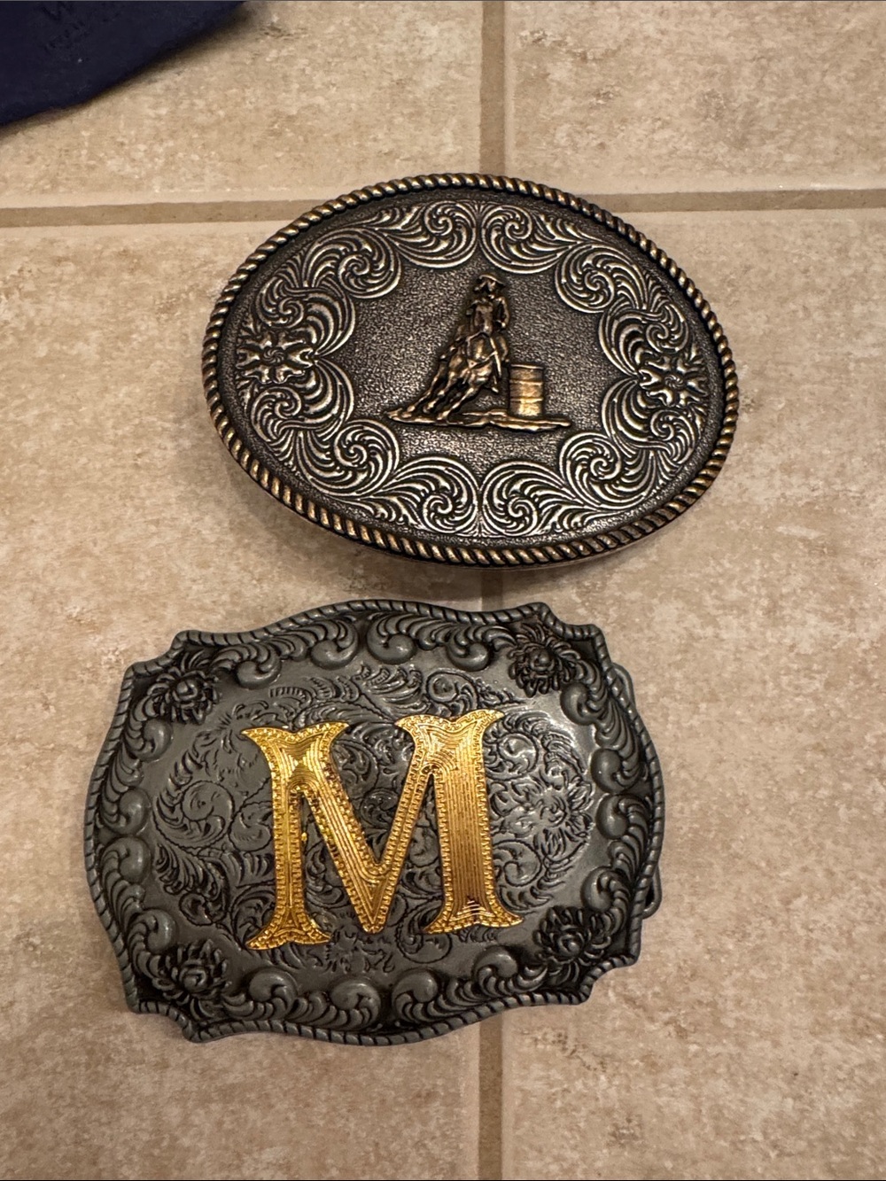 Embossed Black Belt Buckle with Gold 'M' Accent - Western Style